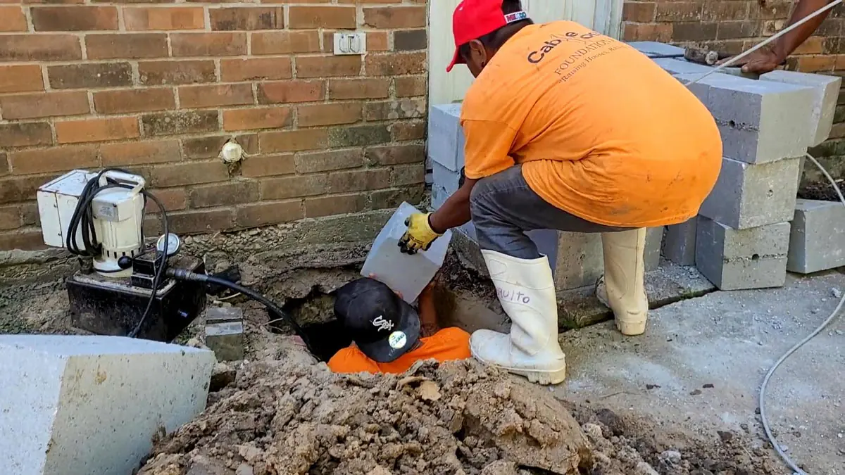 Cable Lock patented piling system being installed during the foundation repair process